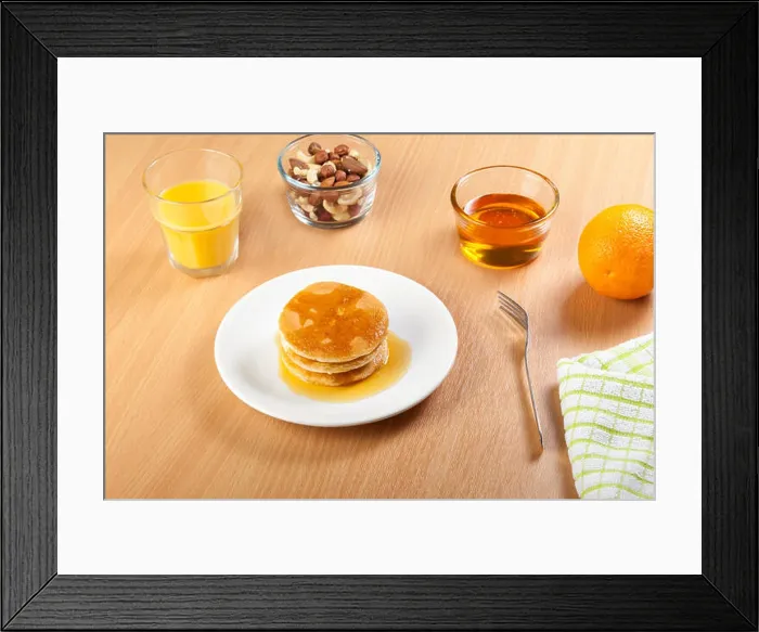 Framed Print : Plate of syrup covered pancakes with a bowl of mixed nuts Framed Print : Plate of syrup covered pancakes with a bowl of mixed nuts