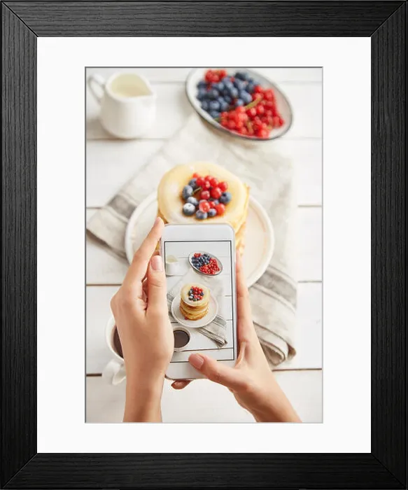 Framed Print : Cropped hands of woman photographing breakfast served on wooden table at home Framed Print : Cropped hands of woman photographing breakfast served on wooden table at home