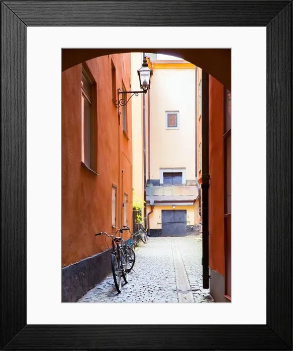 Framed Print : Old street in Gamla Stan district in Stockholm, Sweden. Shallow DOF! Focus on the bicycle by the wall Framed Print : Old street in Gamla Stan district in Stockholm, Sweden. Shallow DOF! Focus on the bicycle by the wall