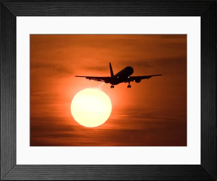 Framed Print : Silhouette of a Boeing 757 civil airliner landing at London Heathrow airport against a large golden sun at sunset Framed Print : Silhouette of a Boeing 757 civil airliner landing at London Heathrow airport against a large golden sun at sunset