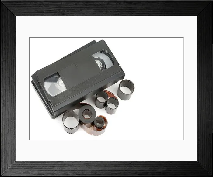 Framed Print : A set of video tapes and photographic film isolated on white background Framed Print : A set of video tapes and photographic film isolated on white background