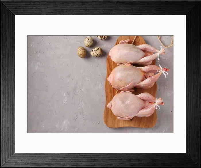 Framed Print : Fresh raw organic quails on wooden board and quail eggs on a gray background, Copy space Framed Print : Fresh raw organic quails on wooden board and quail eggs on a gray background, Copy space