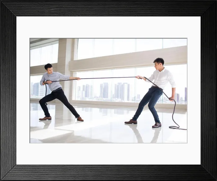 Framed Print : Young businessmen pulling rope Framed Print : Young businessmen pulling rope