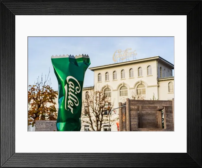Framed Print : Broc, Canton of Fribourg, Switzerland. Maison Cailler chocolate factory white building exterior and visitor entrance Framed Print : Broc, Canton of Fribourg, Switzerland. Maison Cailler chocolate factory white building exterior and visitor entrance