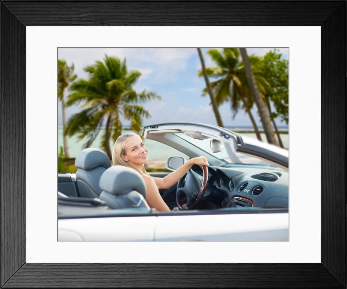 Framed Print : happy woman driving convertible car over beach Framed Print : happy woman driving convertible car over beach