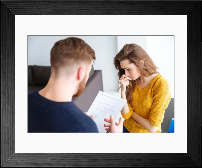 Framed Print : Worried couple discussing about domestic finances at home Framed Print : Worried couple discussing about domestic finances at home