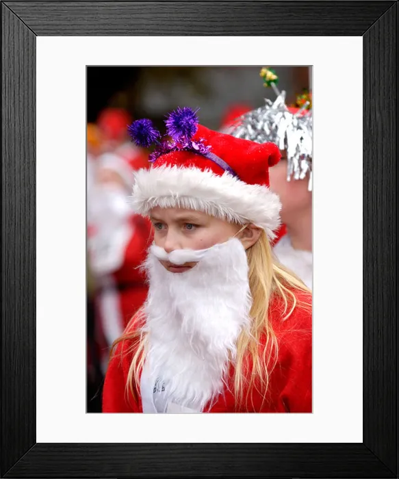 Framed Print : Young woman dressed as Santa Claus for the annual charity Santa Fun Run at Newtown Powys Wales UK Framed Print : Young woman dressed as Santa Claus for the annual charity Santa Fun Run at Newtown Powys Wales UK
