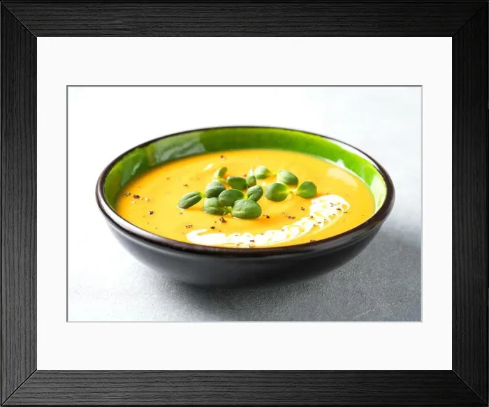 Framed Print : Butternut squash cream soup garnished with heavy cream and fresh sunflower microgreen