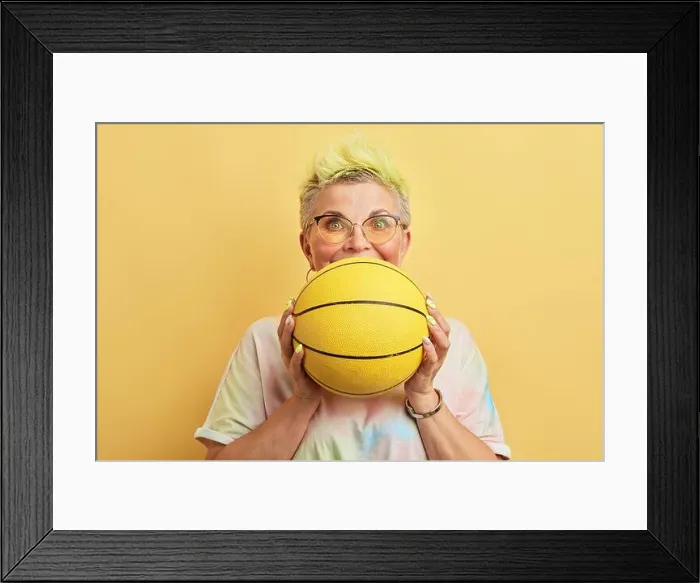 Framed Print : funny awsome old woman with dyed hair having fun with a basket ball Framed Print : funny awsome old woman with dyed hair having fun with a basket ball