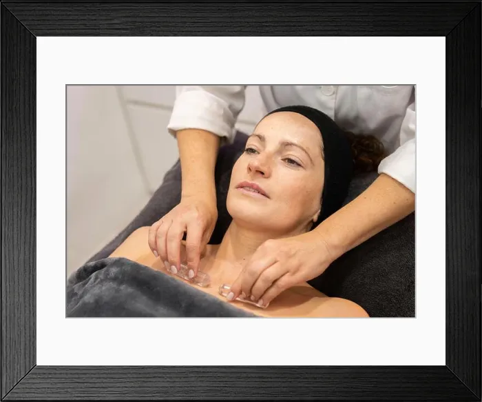 Framed Print : Crop masseuse doing massage to client in salon