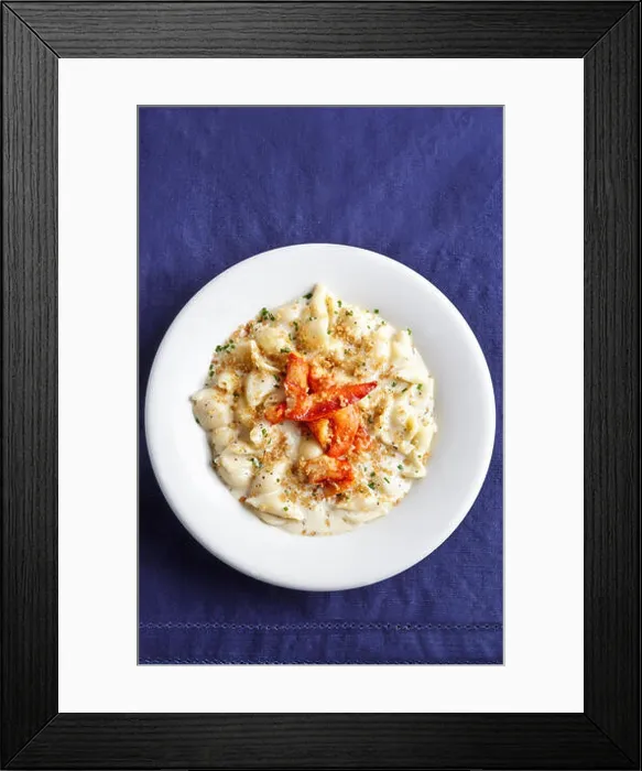 Framed Print : Lobster Mac and Cheese in a white plate with white napkin and dark navy table cloth Framed Print : Lobster Mac and Cheese in a white plate with white napkin and dark navy table cloth