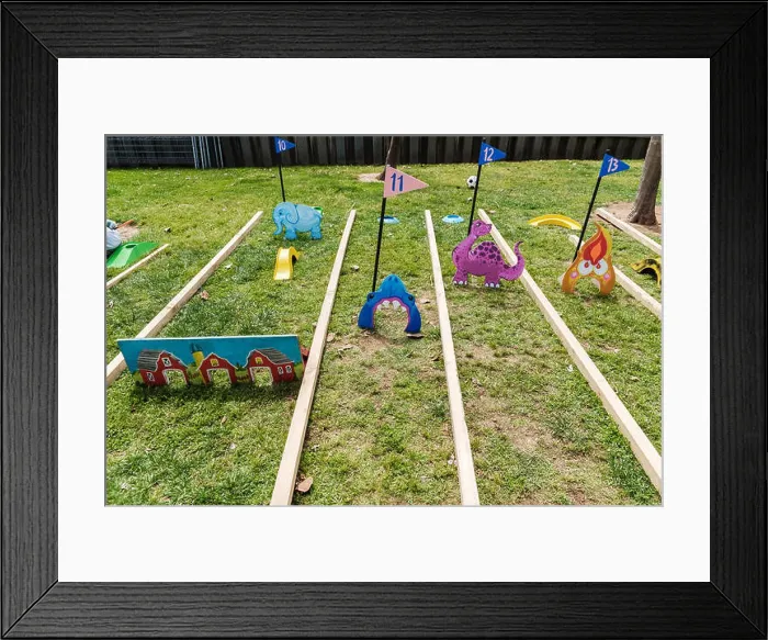 Framed Print : Valencia, Spain - April 29, 2019: Portable mini-golf placed on the lawn for children's fun