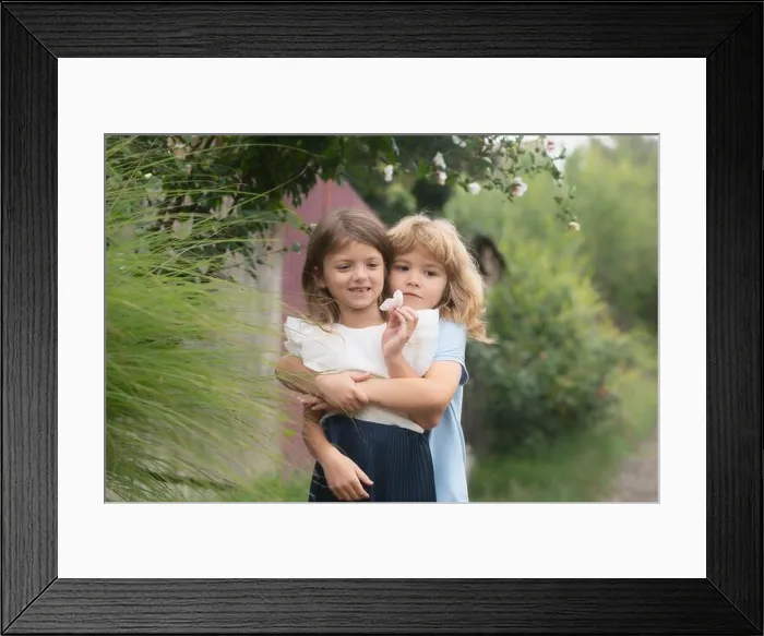 Framed Print : Hugging and kissing kids couple Framed Print : Hugging and kissing kids couple