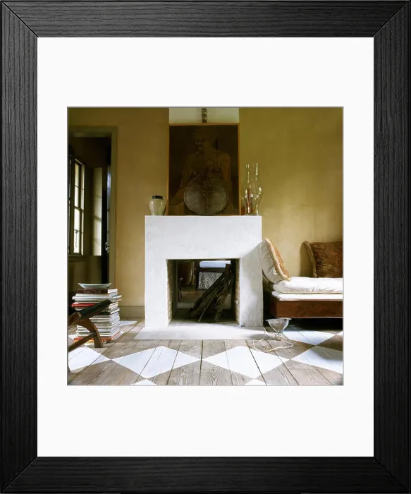 Framed Print : Yellow sitting room with simple fireplace and painted floorboards Framed Print : Yellow sitting room with simple fireplace and painted floorboards