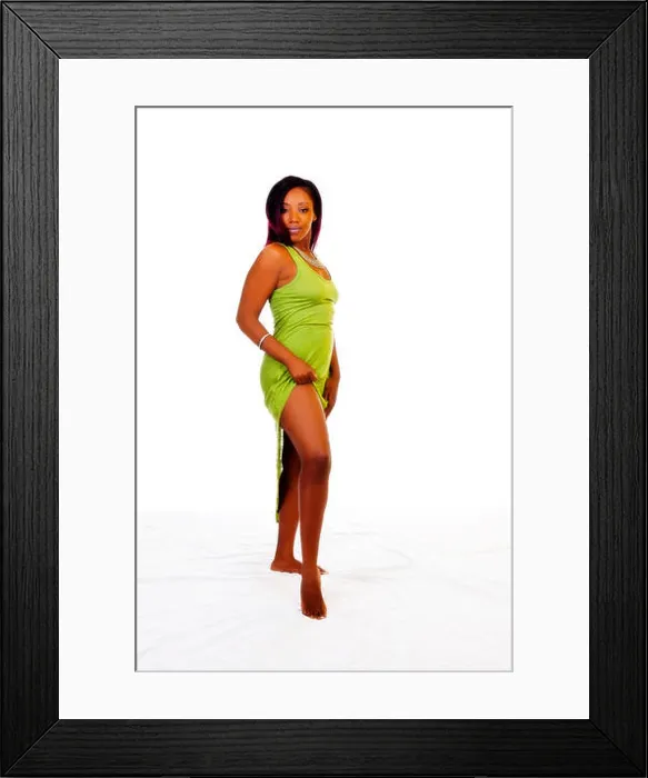 Framed Print : Black Woman Standing In Green Dress Showing Legs Framed Print : Black Woman Standing In Green Dress Showing Legs