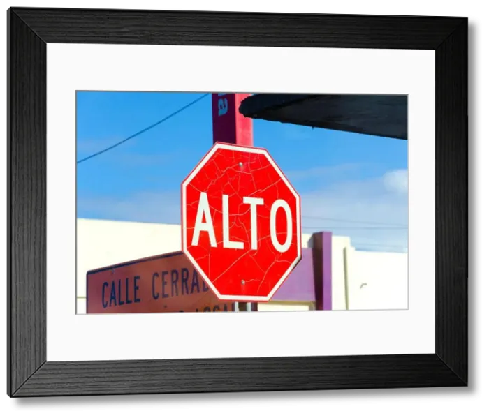 Framed Print : An old, cracked, grungy road sign saying ‘Alto which means Stop in Spanish Framed Print : An old, cracked, grungy road sign saying ‘Alto which means Stop in Spanish