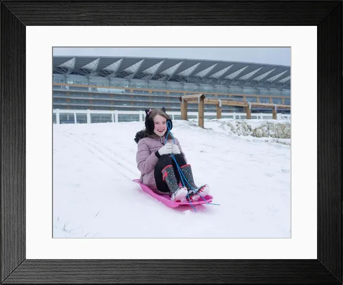 Framed Print : 18th March 2018: Ascot, UK - Daisy Spiers, 10, sledging at Ascot Racecourse Credit: Andrew Spiers / Alamy Live News Framed Print : 18th March 2018: Ascot, UK - Daisy Spiers, 10, sledging at Ascot Racecourse Credit: Andrew Spiers / Alamy Live News