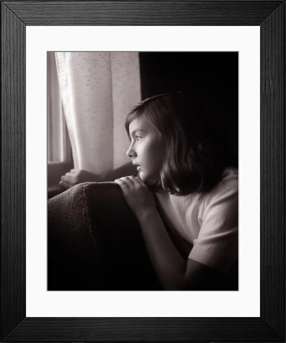 Framed Print : 1960s SERIOUS SAD TEENAGE GIRL SITTING IN DARKENED ROOM HOLDING BACK CURTAIN LOOKING OUT OF THE WINDOW WITH Framed Print : 1960s SERIOUS SAD TEENAGE GIRL SITTING IN DARKENED ROOM HOLDING BACK CURTAIN LOOKING OUT OF THE WINDOW WITH