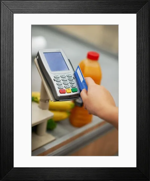 Framed Print : Credit card, hand and swipe in supermarket for payment