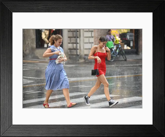 Framed Print : Italian young girls crossing the street in the rain. Via Ugo Bassi, Bologna, Italy Framed Print : Italian young girls crossing the street in the rain. Via Ugo Bassi, Bologna, Italy