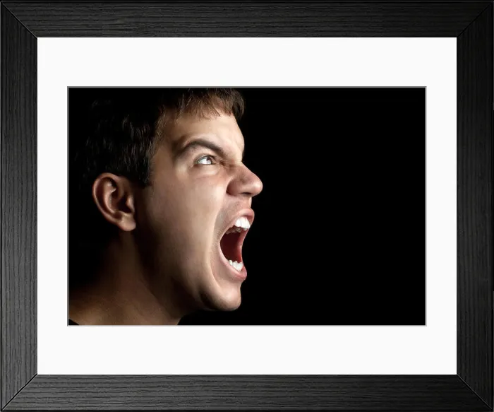 Framed Print : portrait of young angry man sreaming isolated on black background Framed Print : portrait of young angry man sreaming isolated on black background