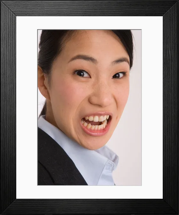 Framed Print : Portrait of a businesswoman looking angry Framed Print : Portrait of a businesswoman looking angry
