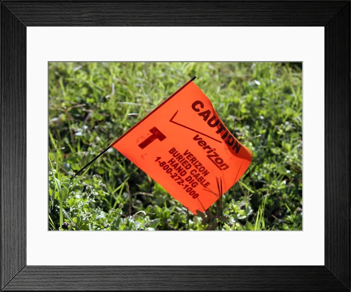 Framed Print : Buried cable warning flag Framed Print : Buried cable warning flag