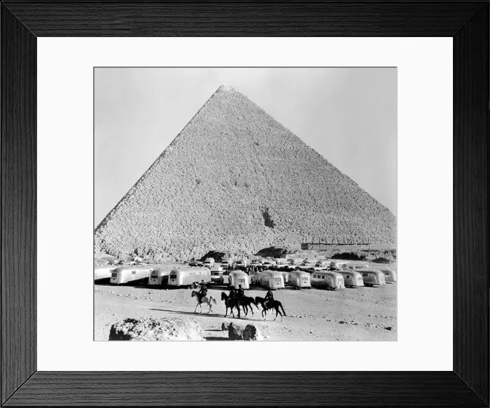 Framed Print : A group of American Airstream Trailers on a caravan gather at the Pyramids at Giza near Cairo in Egypt Framed Print : A group of American Airstream Trailers on a caravan gather at the Pyramids at Giza near Cairo in Egypt