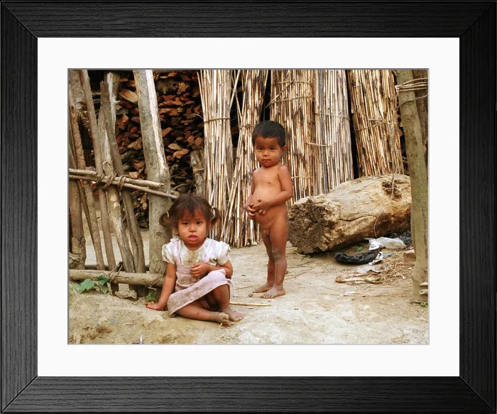 Framed Print : Girl and boy in front of a wood cabin in Nepal Framed Print : Girl and boy in front of a wood cabin in Nepal