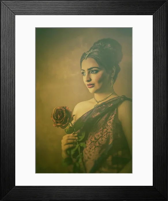 Framed Print : Beautiful Indian woman holding a rose looking away