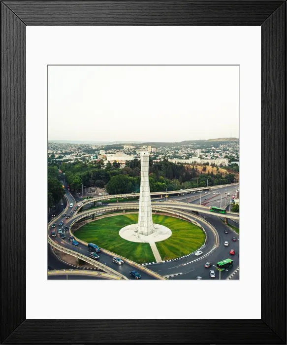 Framed Print : Tbilisi, Georgia - 15th july, 2022: aerial view automobiles in traffic on roundabout in Tbilisi center Framed Print : Tbilisi, Georgia - 15th july, 2022: aerial view automobiles in traffic on roundabout in Tbilisi center