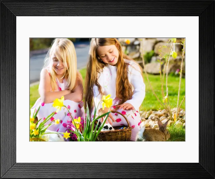 Framed Print : Children on an Easter Egg hunt on a meadow in spring, a living Easter Bunny is sitting in the Easter basket Framed Print : Children on an Easter Egg hunt on a meadow in spring, a living Easter Bunny is sitting in the Easter basket