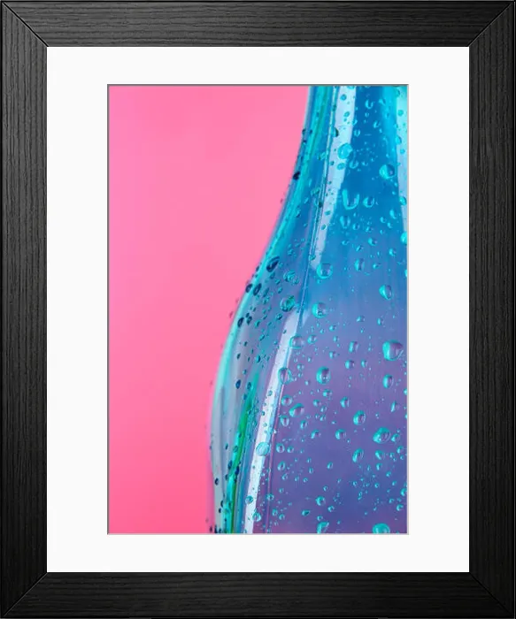 Framed Print : Colorful bottle on pink background Framed Print : Colorful bottle on pink background