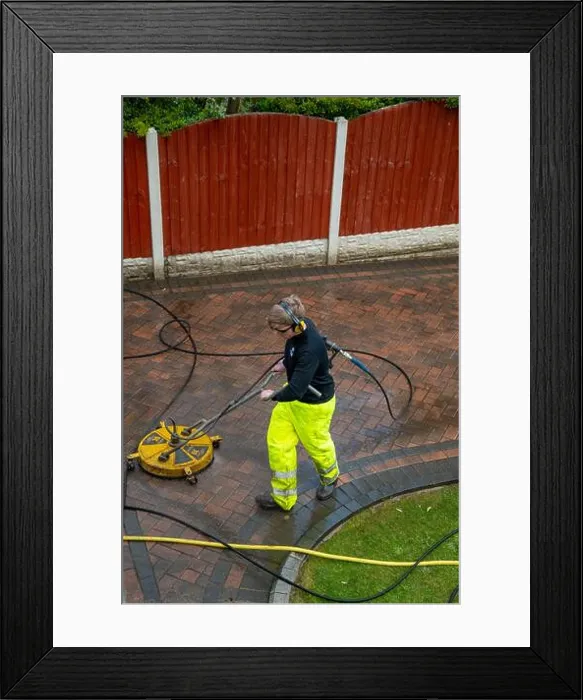 Framed Print : Contractors cleaning domestic block paved driveway with high pressure water Framed Print : Contractors cleaning domestic block paved driveway with high pressure water