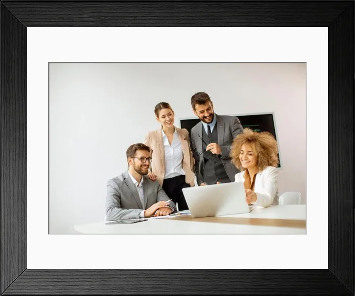 Framed Print : Young business people sitting at meeting table in conference room discussing work and planning strategy Framed Print : Young business people sitting at meeting table in conference room discussing work and planning strategy