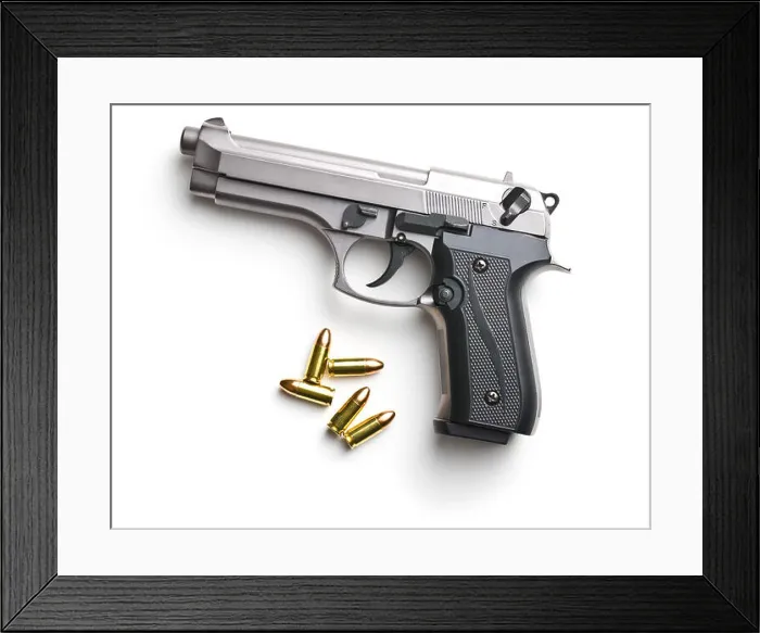 Framed Print : 9mm pistol bullets and handgun isolated on white background Framed Print : 9mm pistol bullets and handgun isolated on white background