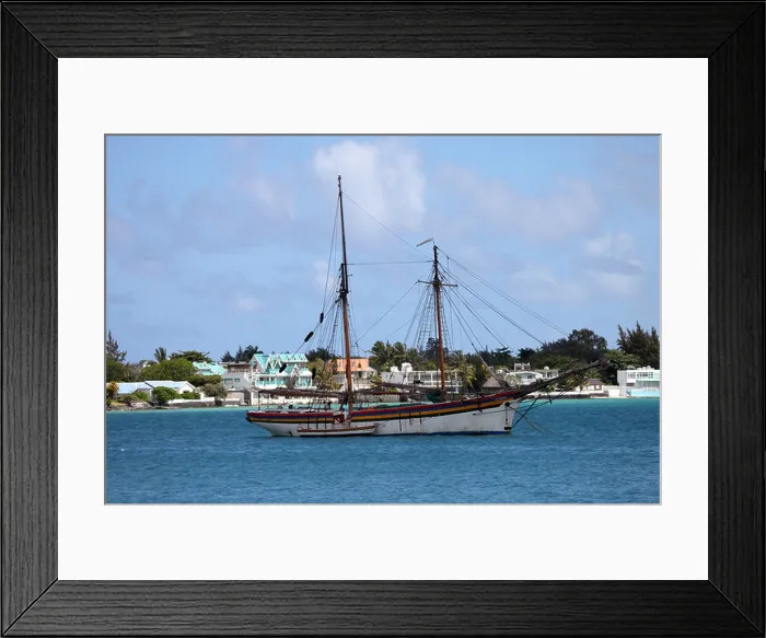 Framed Print : Sailing boat moored in a bay on the island of Mauritius Framed Print : Sailing boat moored in a bay on the island of Mauritius