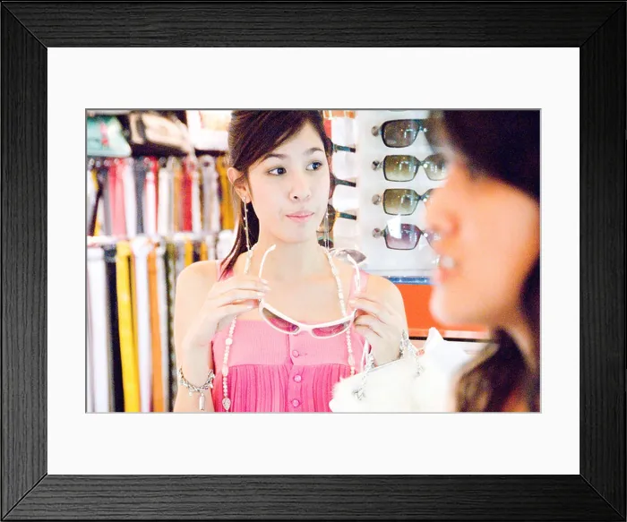 Framed Print : A young, cute, Thai woman shops for sundries and the things that she likes in Siam Square, Bangkok, Thailand Framed Print : A young, cute, Thai woman shops for sundries and the things that she likes in Siam Square, Bangkok, Thailand