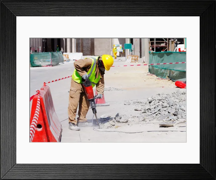 Framed Print : A steel fixer carefully tying reinforced steel bars in position in preparation for the construction of a concrete slab Framed Print : A steel fixer carefully tying reinforced steel bars in position in preparation for the construction of a concrete slab