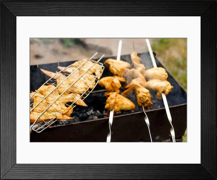 Framed Print : Blurred delicious chicken wings barbecue on hot grill