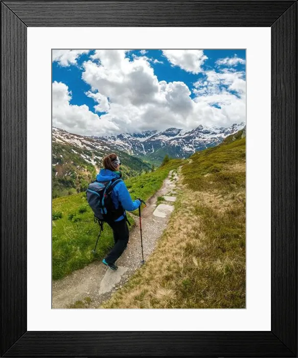 Framed Print : Young woman hiking on footpath in the Austrian Alps near Gastein, Salzburg, Austria Framed Print : Young woman hiking on footpath in the Austrian Alps near Gastein, Salzburg, Austria