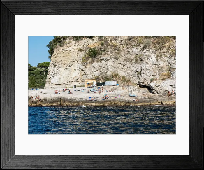 Framed Print : Sunbathers enjoy a rugged rock beach along the Sorrento coast, Compania, Italy Framed Print : Sunbathers enjoy a rugged rock beach along the Sorrento coast, Compania, Italy
