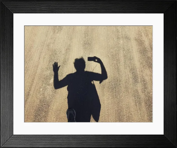 Framed Print : Shdow of man walking on a path Framed Print : Shdow of man walking on a path