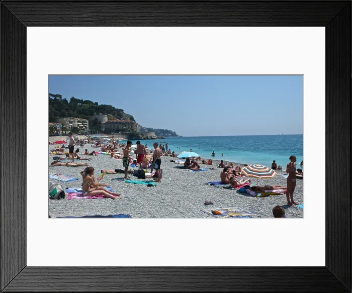 Framed Print : Sunbathers populate the shoreline of the French Riviera Framed Print : Sunbathers populate the shoreline of the French Riviera