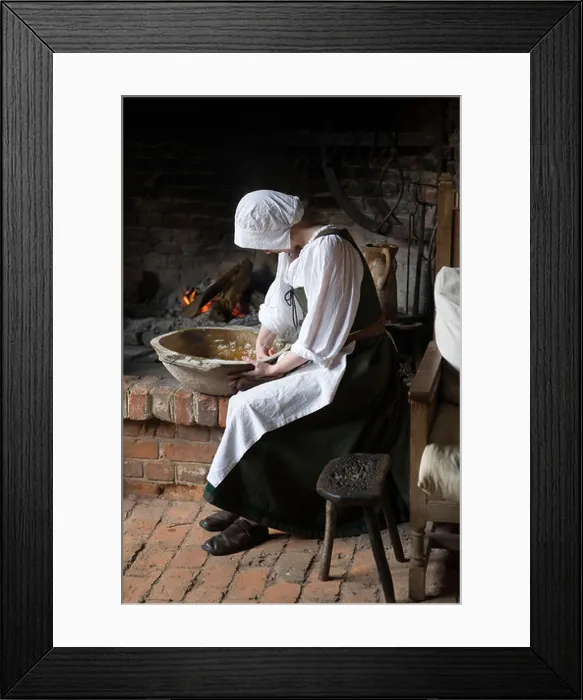 Framed Print : Kitchen servant preparing food in Kentwell Hall during a Tudor re-creation day Framed Print : Kitchen servant preparing food in Kentwell Hall during a Tudor re-creation day