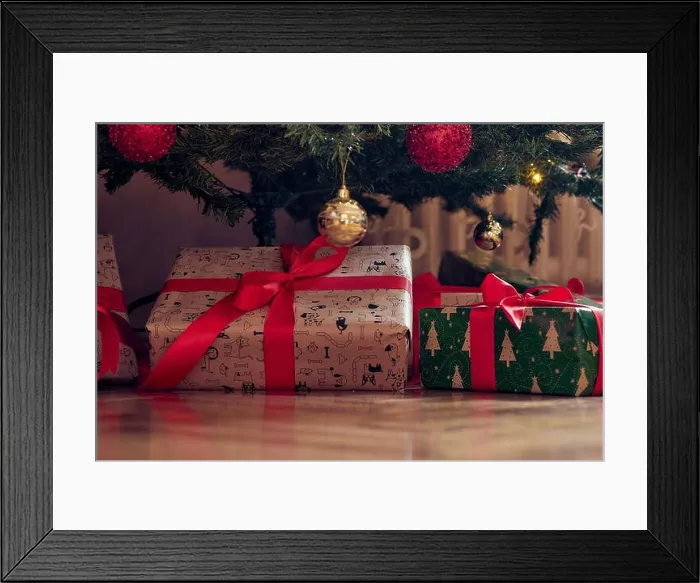 Framed Print : Close-up of presents spread over the floor under the christmas tree on a beautiful holiday at home Framed Print : Close-up of presents spread over the floor under the christmas tree on a beautiful holiday at home