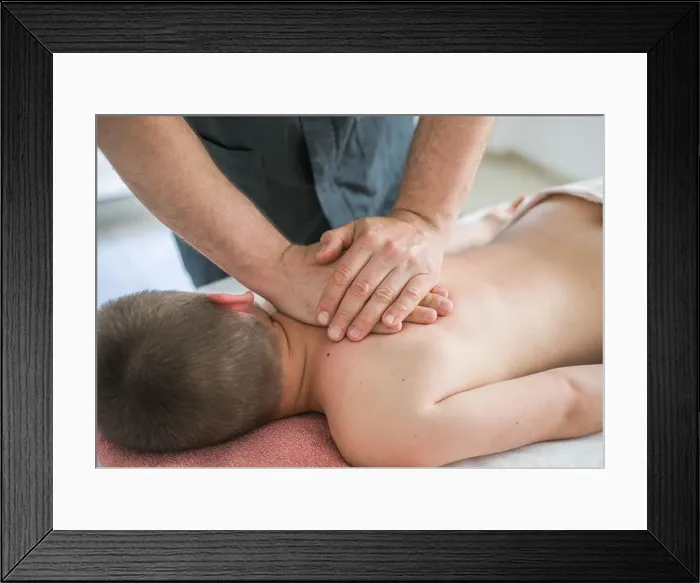 Framed Print : Boy toddler relaxes from a therapeutic massage Framed Print : Boy toddler relaxes from a therapeutic massage