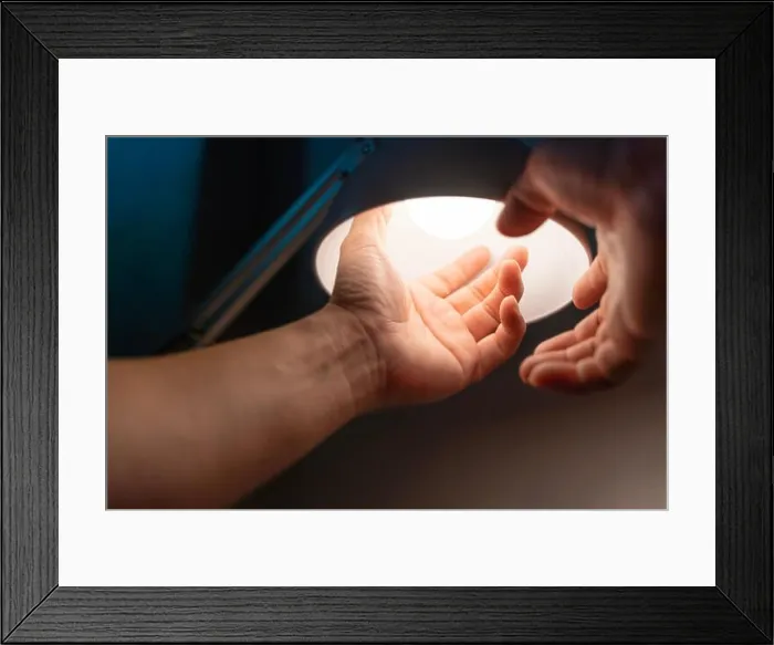 Framed Print : man turning into a light bulb LED at the table lamp, electricity change warm light at home. Empty space to enter text Framed Print : man turning into a light bulb LED at the table lamp, electricity change warm light at home. Empty space to enter text