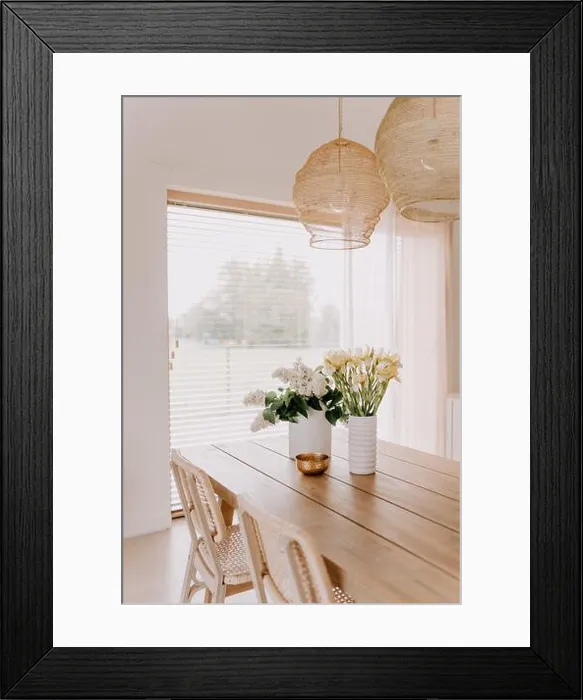 Framed Print : An interior shot of a contemporary styled living space with a wooden table and vases full of flowers Framed Print : An interior shot of a contemporary styled living space with a wooden table and vases full of flowers