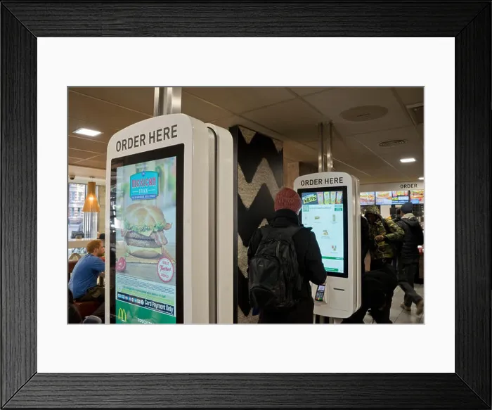 Framed Print : New menu ordering terminals at McDonald's fast food restaurant in Manchester.UK Framed Print : New menu ordering terminals at McDonald's fast food restaurant in Manchester.UK
